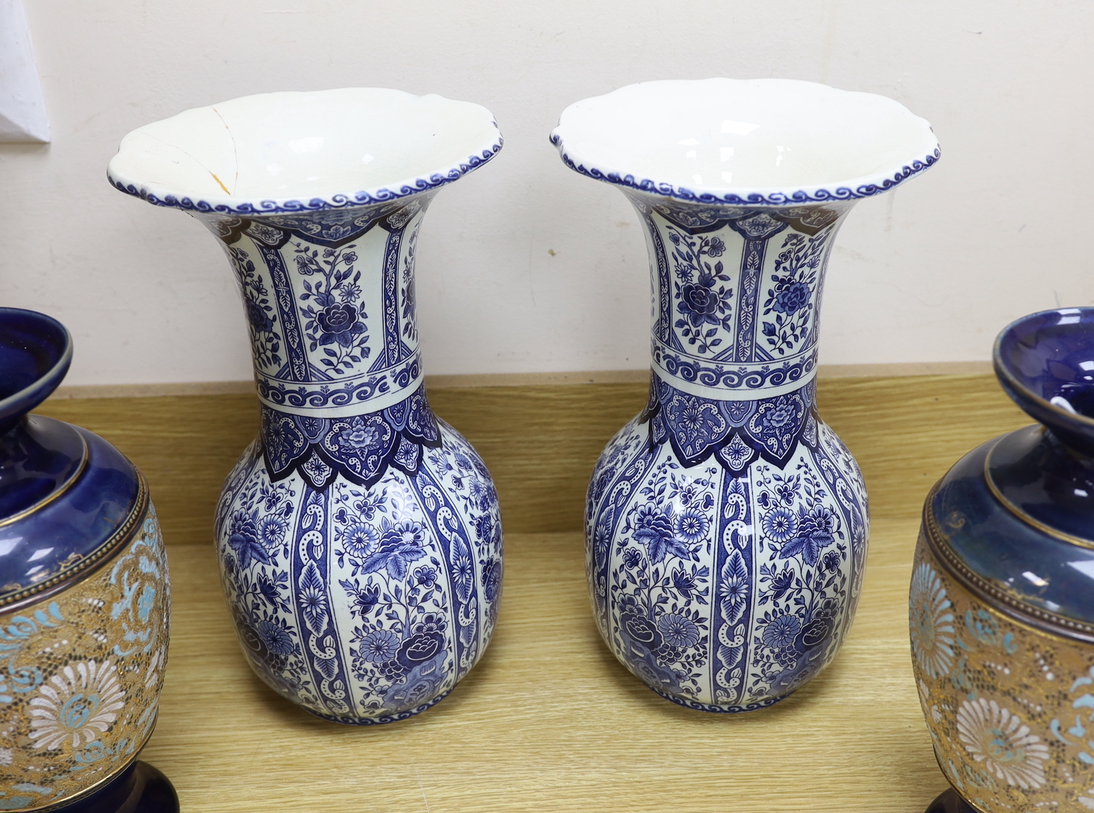 Seven ceramic pieces including a pair of Royal Doulton vases, Coalport dish and Delft jar and cover, 34cm high